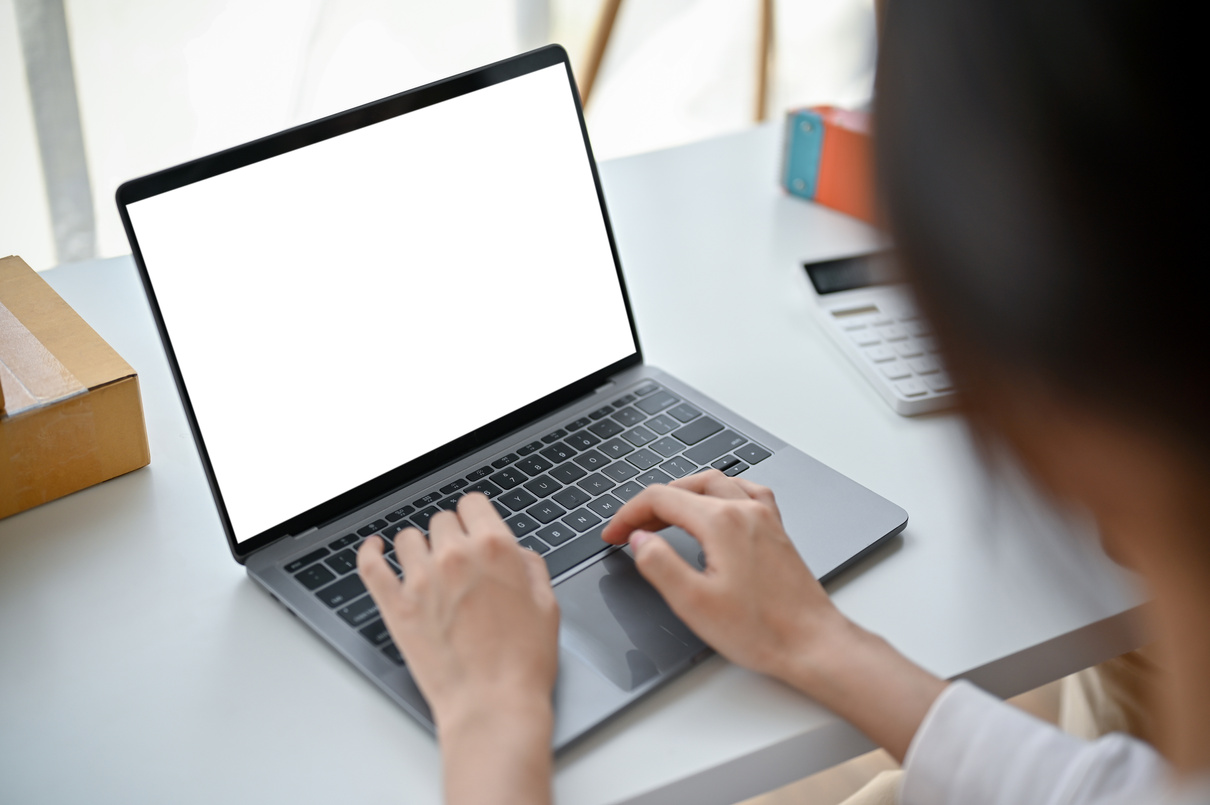 A female online business owner answering customers' questions on
